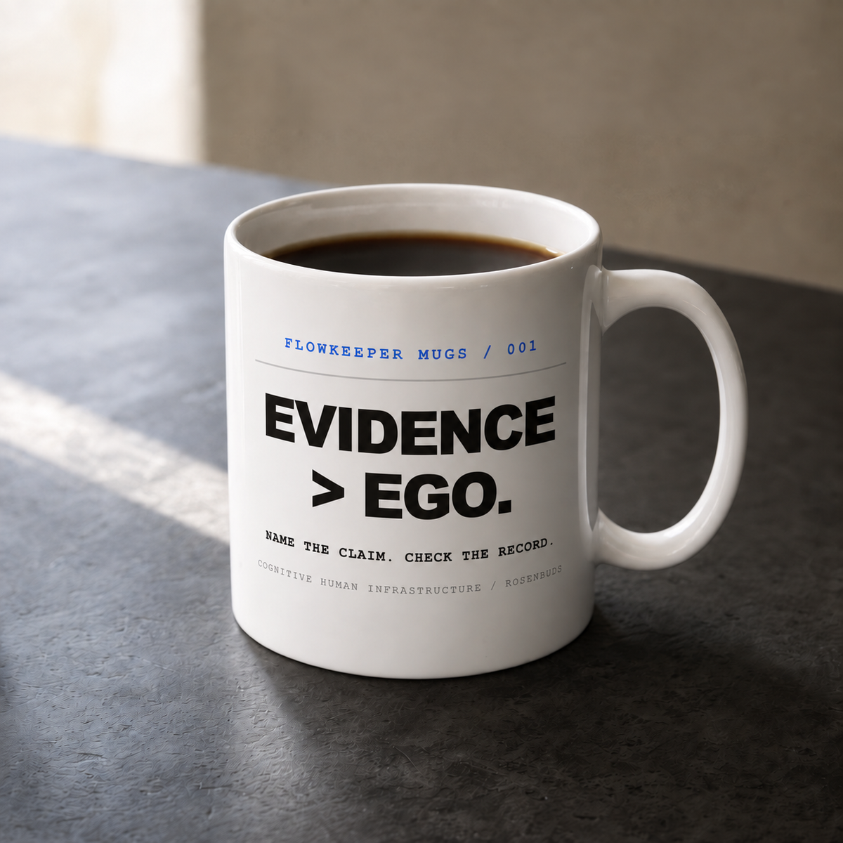 White 11 oz Flowkeeper Mug printed with 'Evidence > Ego.'